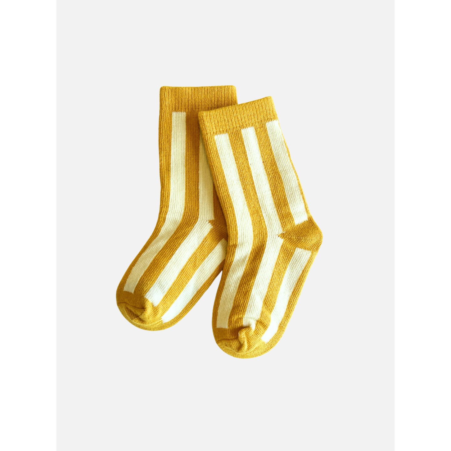 Marigold | A pair of comfy STRIPE SOCK in marigold with vertical white stripes, crafted from stretchy cotton, on a plain white background.