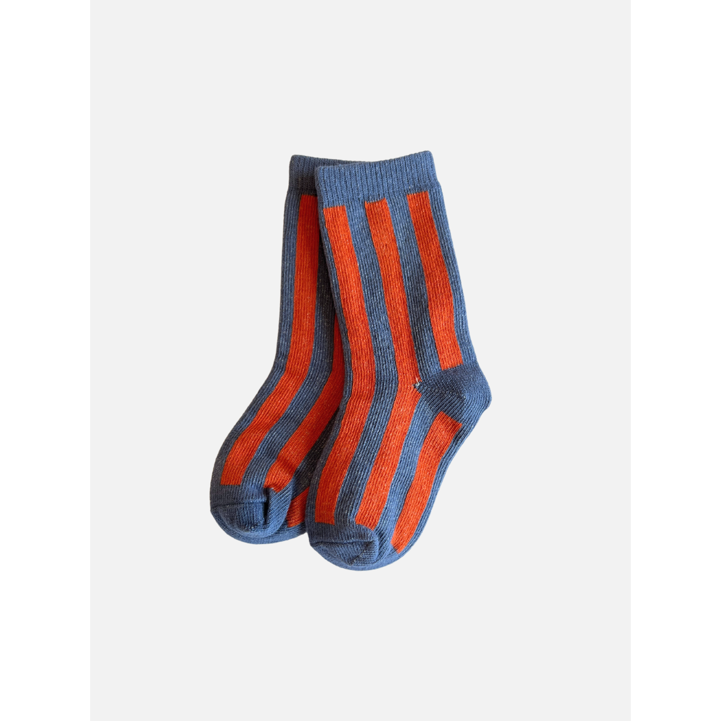 Slate | A pair of comfy, stripy socks with a slate base and orange vertical stripes, made from stretchy cotton, placed against a white background. The product is named STRIPE SOCK.