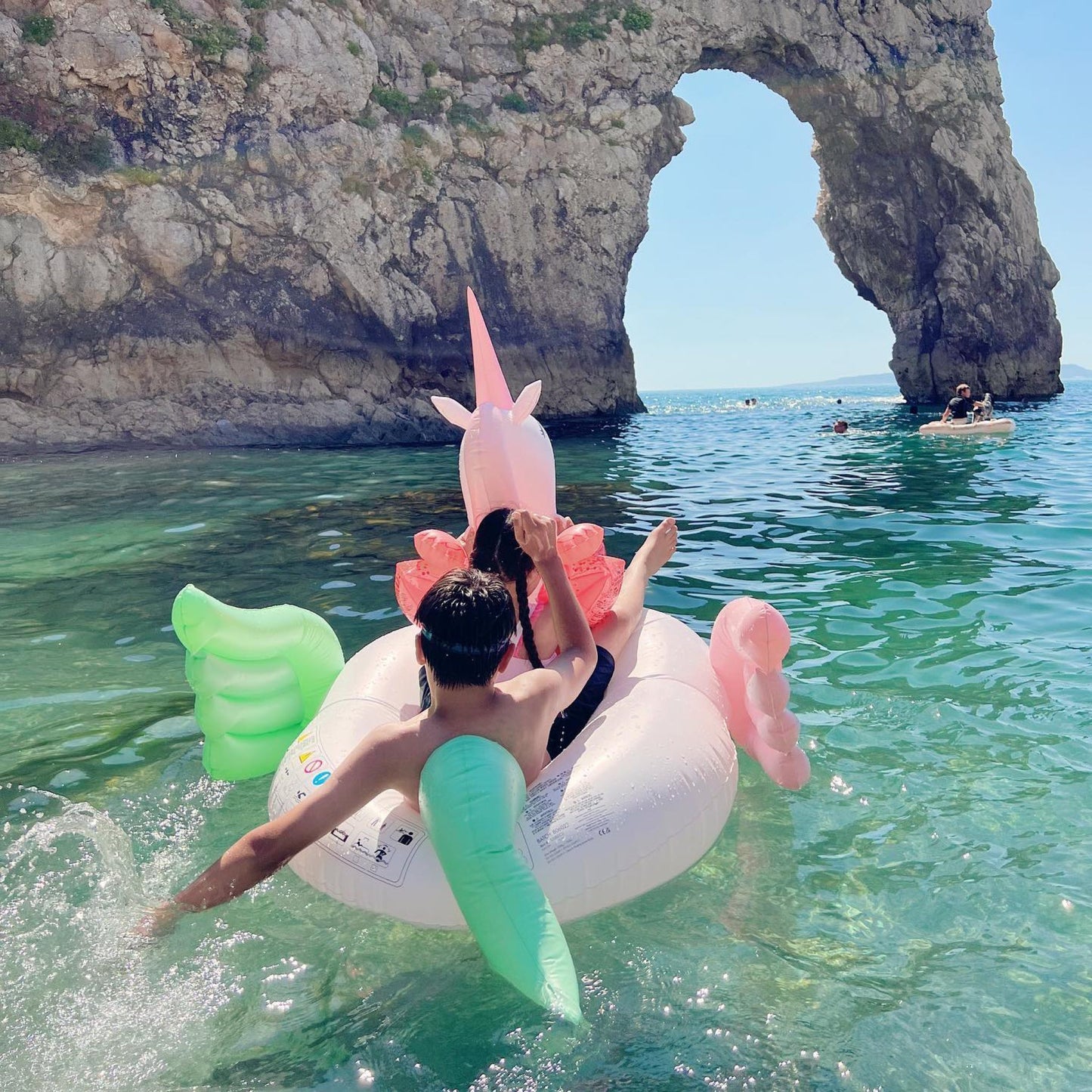 Luxe Ride-On Unicorn Pool Float Coral Ombre