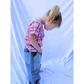 Medium Wash | A child is wearing double trouble jeans with a checkered pink tee