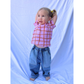 Medium Wash | A child is wearing double trouble jeans with a checkered tee