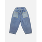Medium Wash | A pair of kids' jeans in mid blue denim with two lighter blue pockets, back view