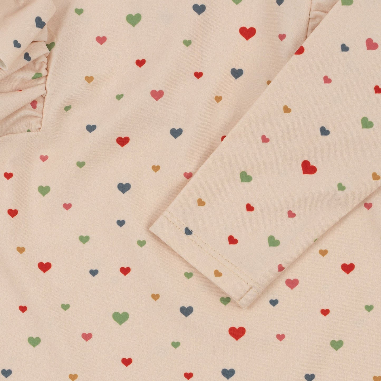 MANUCA FRILL ONESIE - MULTI HEARTS